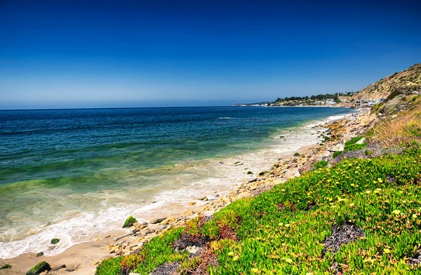 The Pacific Ocean and coastline of california along the PCH near malibu. 