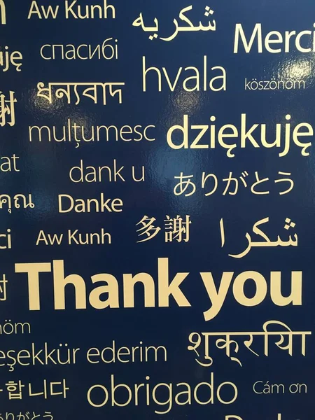 Thank you in different languages on a black background.