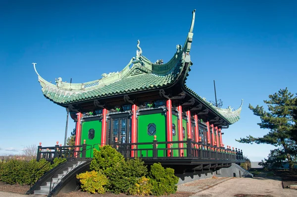 The chinese tea house overlooking the atlantic ocean at the marble house in newport rhode island in autumn.