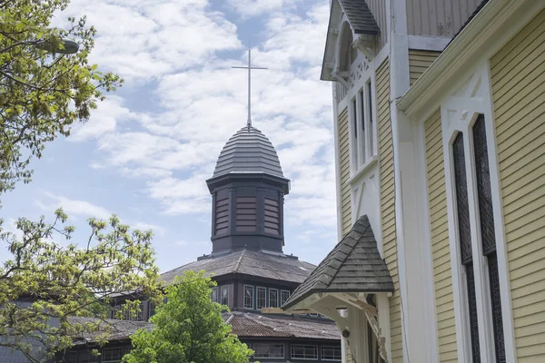 The landmark Trinty church and Tabernacle within the Martha\'s Vineyard Camp Meeting Associating historic area in Oak Bluffs Massachusetts.
