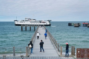 Oak Bluffs, Massachusetts. May 23, 2022. The nantucket ferry coming into oak bluffs massachusetts on a cloudy day on martha's vineyard. 
