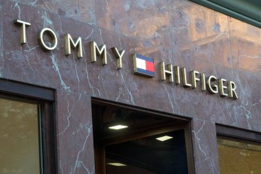 Prague, Czech Republic - July 22, 2020: Tommy Hilfiger store sign. Tommy Hilfiger Corporation is an American premium clothing company, manufacturing apparel, footwear, accessories, and fragrances 