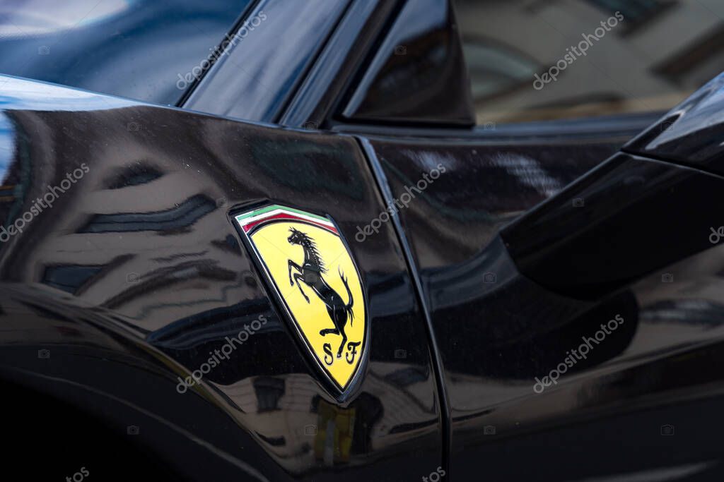 Prague, Czech Republic - July 25, 2020: Ferrari emblem on a car. Ferrari SpA is an Italian sports car manufacturer based in Maranello. Founded by Enzo Ferrari, the company built first car in 1940