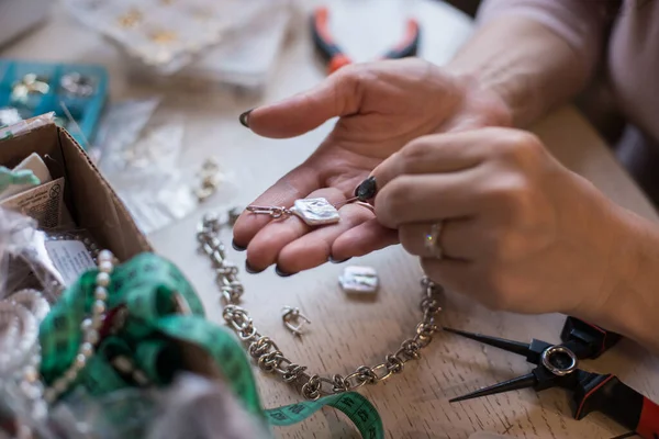 Hands of the master of jewelry and ornaments