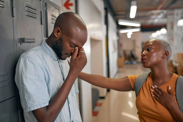 A depressed stressed young black man is comforted by his friend at college — Stock Photo, Image