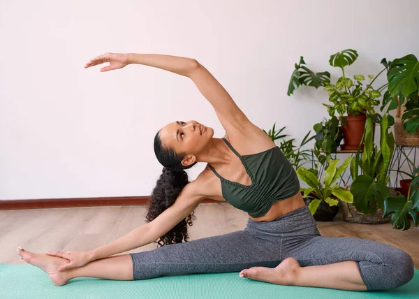 Young Multi Ethnic Woman Reaches Overhead Seated Side Stretch Yoga — стоковое фото