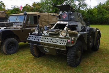 ST NEOTS, CAMBRIDGESHIRE, ENGLAND - JULY 02, 2022:  Vintage  armoured scout car parked on grass.
