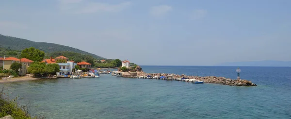 The Tiny Mermaid Madonna Church sits right by the harbour at Skala Sikaminias  Lesvos Greece