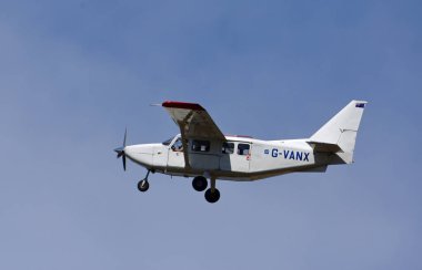 ICKWELL, BEDFORDSHIRE, ENGLAND - AUGUST 07, 2022: Gippsland GA-8TC Airvan aircraft in flight blue sky.