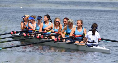 ST NEOTS, CAMBRIDGESHIRE, ENGLAND -  JULY 23, 2022: Ladies coxed eights resting no the river Ouse.