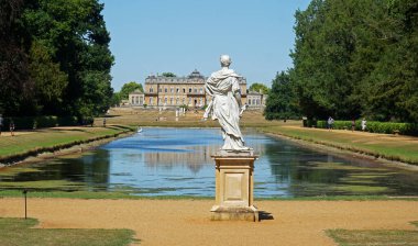 SILSOE, BEDFORDSHIRE, ENGLAND - AUGUST 10, 2022:  Wrest Park Bedfordshire House gardens, lake and statues.