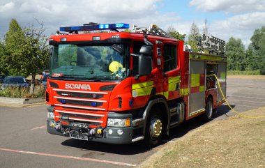 ST NEOTS, CAMBRIDGESHIRE, ENGLAND - AUGUST 24, 2022: Scania Modern Fire engine parked on tarmac