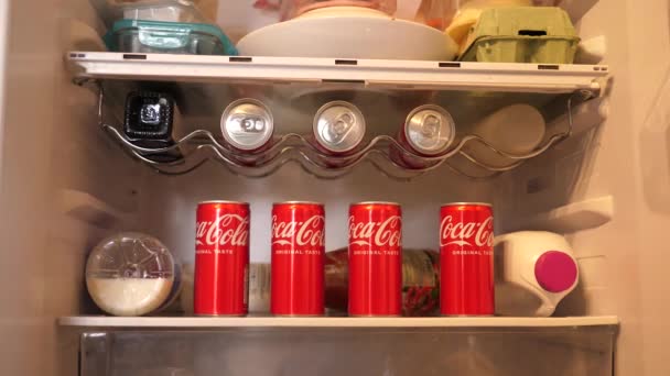 Person Hand Takes Couple Cans Coca Cola Carbonated Drink Fridge — Stock Video