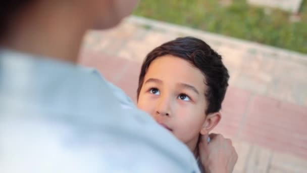 Close View Son Looking His Mom Upwards Mother Hugs Her — Vídeos de Stock