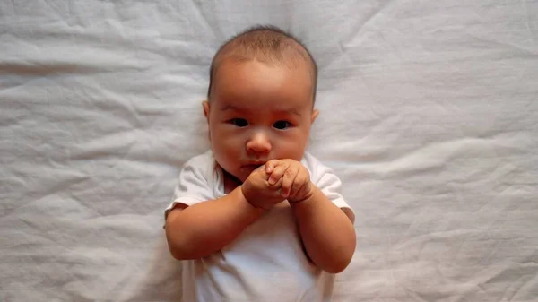 Cute Asian Baby Moves His Hands Put Them Mouth High — 스톡 사진
