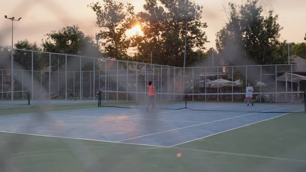 Unrecognisable Tennis Players Court Metallic Net High Quality Footage ストック写真