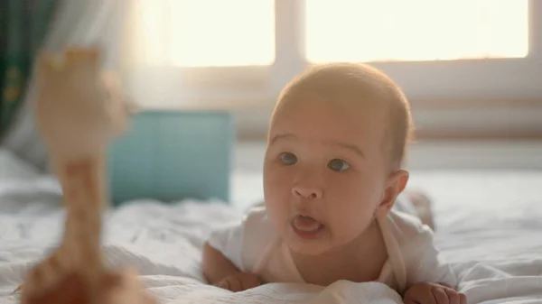 Happy Baby Lying Tummy Bed Looking Toy High Quality Footage — Φωτογραφία Αρχείου