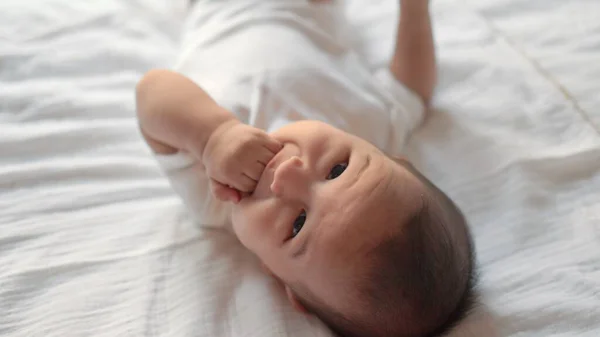 Close View Cute Baby Put Fingers Mouth While Lying Bed — 스톡 사진
