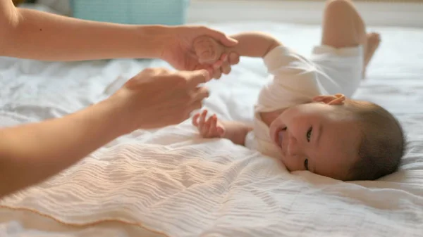 Mother Helps Turn Her Baby Boy Big Bed Babys Turn —  Fotos de Stock