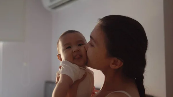 Happy Mother Holding Her Baby Kissing Love Home High Quality — 스톡 사진