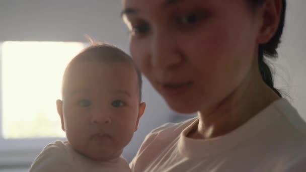 Mother Holds Her Baby Close View Cute Baby Looking Camera — Stockvideo