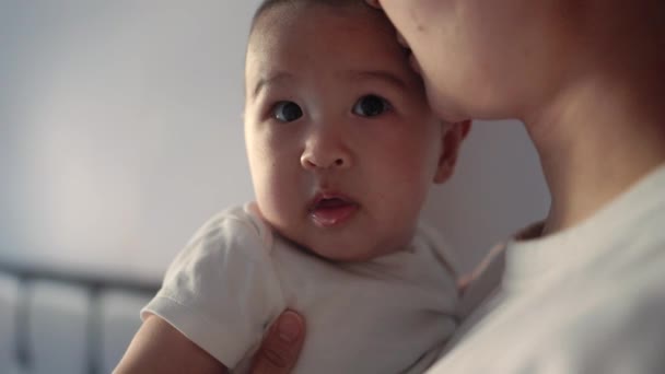 Mother Holds Her Baby Close View Cute Baby Looking Camera — Stockvideo