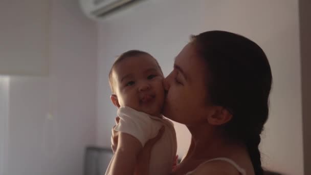 Happy Mother Holding Her Baby Kissing Love Home High Quality — Video Stock