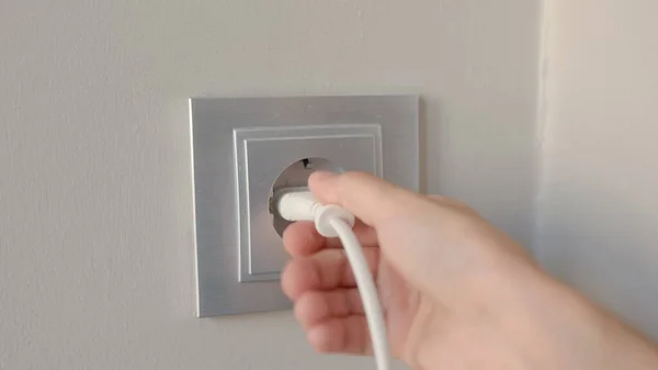 Man Inserts Plug Electrical Socket Wall High Quality Footage — Stok fotoğraf