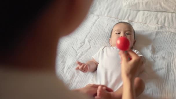 Mother Gives Toy Baby Infant Child Takes Toy High Quality — Vídeo de Stock
