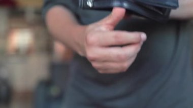 Male hands are shaking an empty wallet. High quality 4k footage