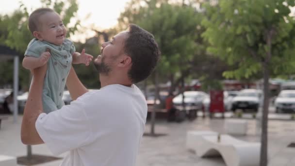 Happy Father Holding Cute Baby Kisses While Laughing High Quality — Vídeo de stock