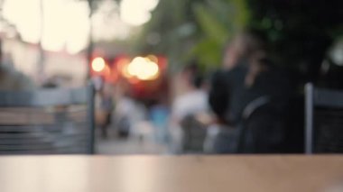 Lens blur, out of focus people in a cafe. High quality 4k footage