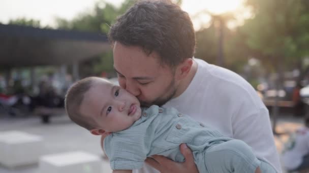 Happy Father Holding Cute Baby Kisses While Laughing High Quality — Stockvideo