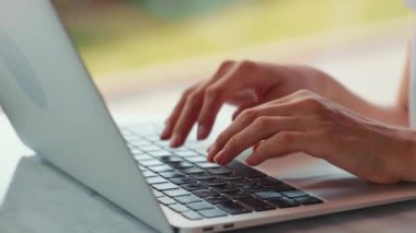 Close up view of womans hands typing on laptop. Remote work. Home office. High quality 4k footage