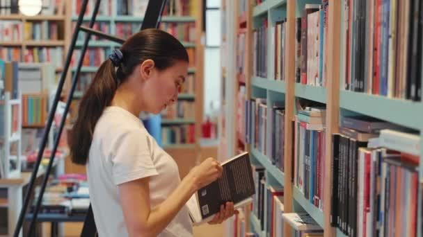 Young Woman Leafing Book Library University Public Library Office Bookshelves — Vídeos de Stock