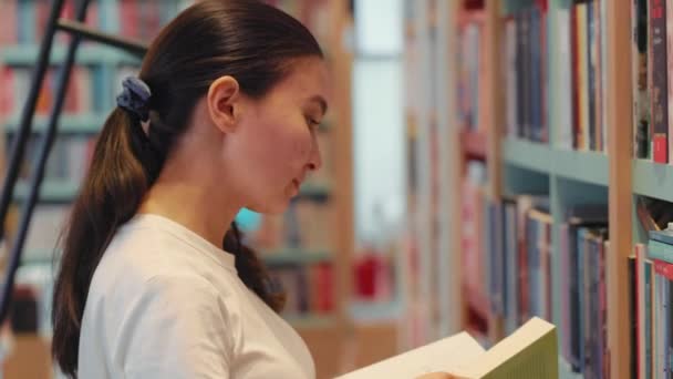 Young Woman Leafing Book Library University Public Library Office Bookshelves — Vídeo de Stock