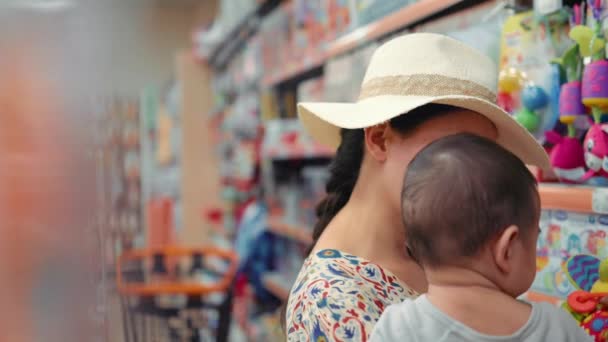 Young Modern Single Mother Choosing Toys Supermarket High Quality Footage — Wideo stockowe