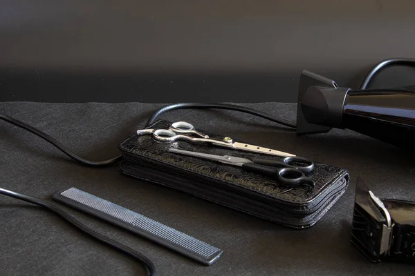 hairdressing tool on a black background, strong plan