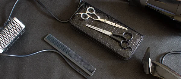 hairdressing tool on a black background, strong plan