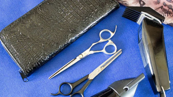 composition with a set of hairdressing tools