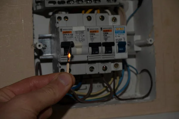 electric switch and lit match, power surge