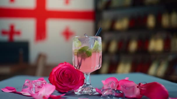 Closeup Pink Cocktail Drink Straw Glass Goblet Rose Petals — Stock Video