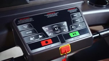 close up of training machine console with key menu for start exercising