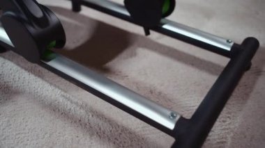 close up of elliptical machine with sliding and magnetic rail indoor