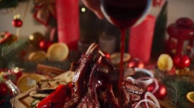 pour berry sauce on grill rib meat with bone, pepper, marrow, onion, new year