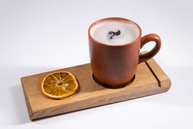 delicious warm gluhwein with orange on white background