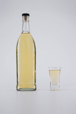 alcoholic beverage with glass isolated on white background