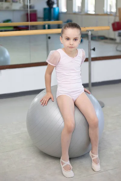 Little Girl Ballerina Pale Pink Tutu Performs Exercises Large Ball — Stock Photo, Image