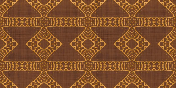 Seamless tribal ethnic earth tones batik surface design pattern on rough linen, a trendy contemporary tileable abstract geometric shibori textile for interior decor and fashion.