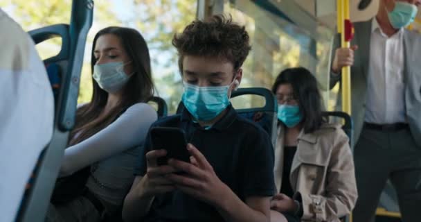 Crowd of people on bus squeeze afternoon in city traffic jams young women sitting in — Stock Video